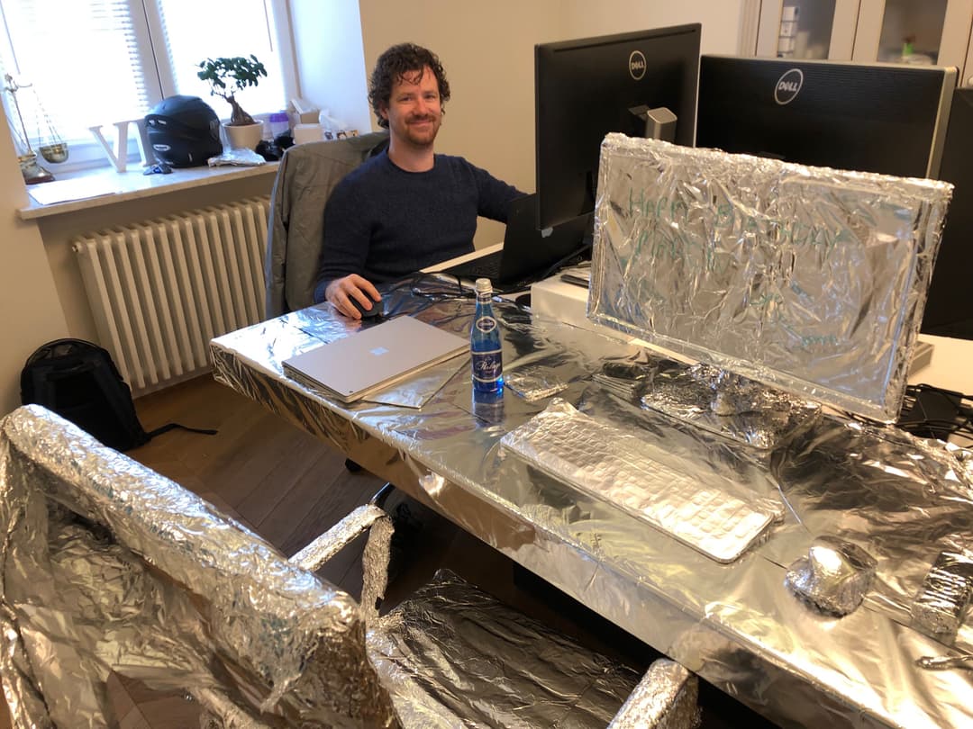 Marcin's desk wrapped in aluminum foil for his birthday