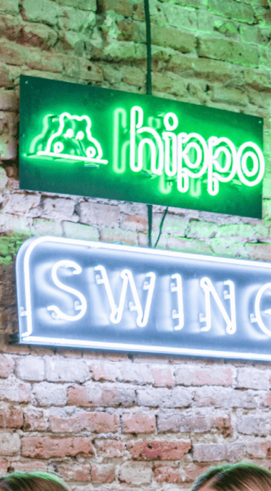 Photo of hippo and SwingDev logo in the Warsaw office